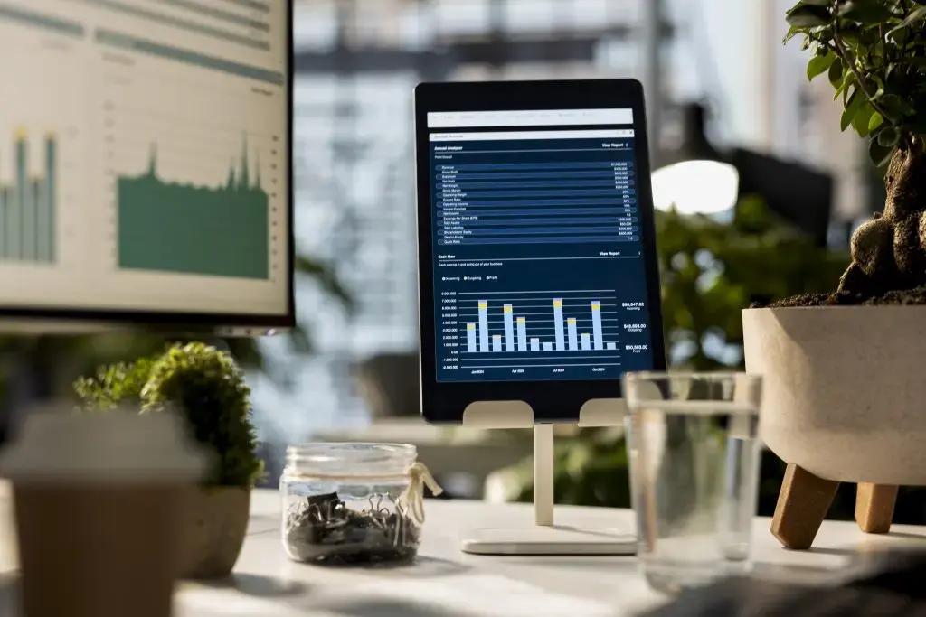 empty-business-workspace-with-device-showing-data-analytics-infographics.jpg